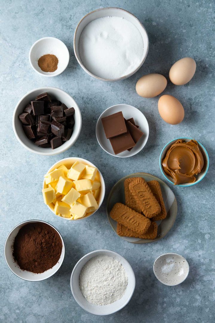 Ingredients needed to make the brownie recipe weighed out and placed in individual bowls.