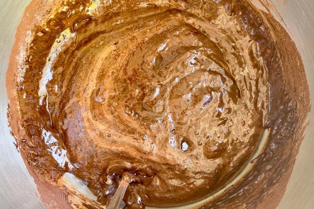 Coco powder and flour added to the wet ingredients.