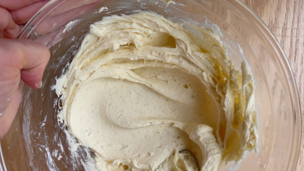 The vanilla buttercream ingredients mixed together in a bowl