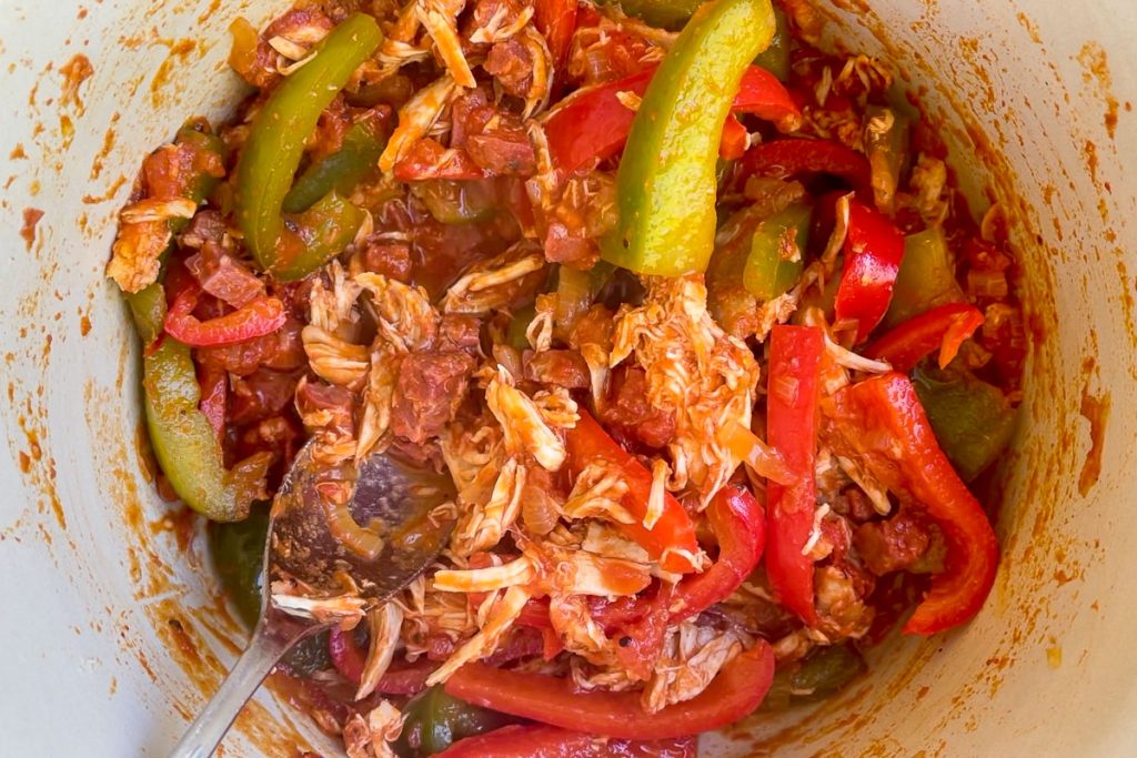 Shredded cooked chicken added to the tomato and pepper mixture.