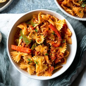 A bowl of chicken and chorizo pasta served and ready to eat.