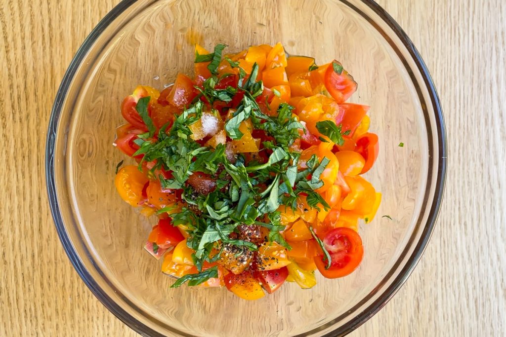 Chopped tomatoes mixed with fresh basil and seasonings.
