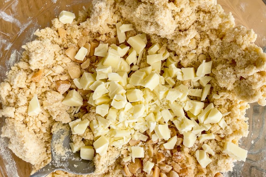 White chocolate chunks and chopped macadamia nuts added to the cookie dough.