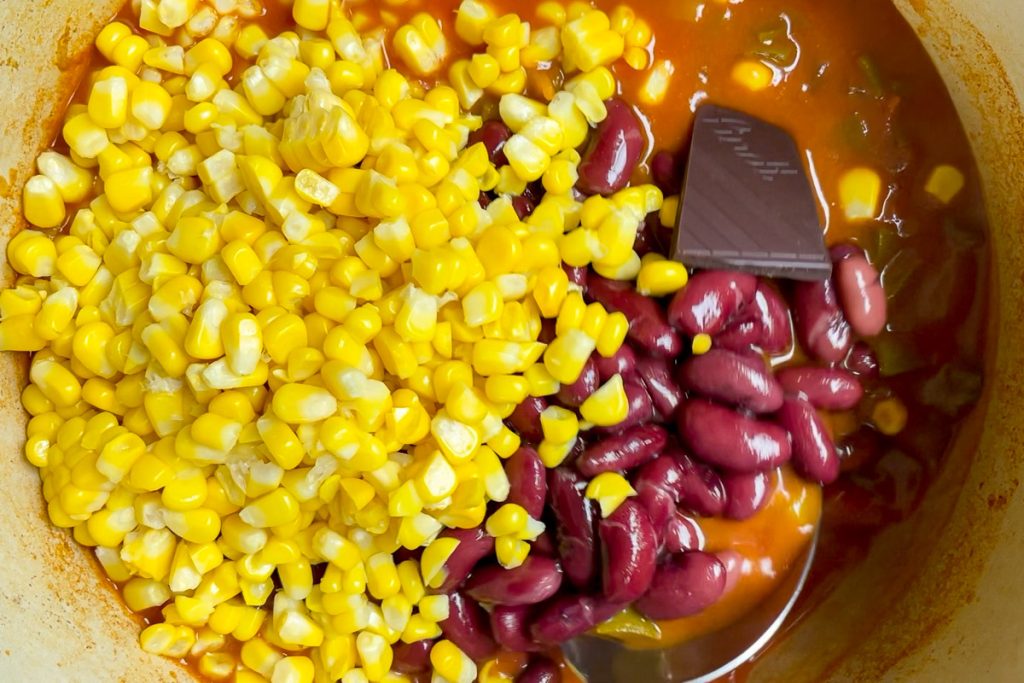 Drained kidney beans and corn added to the vegetarian chili.