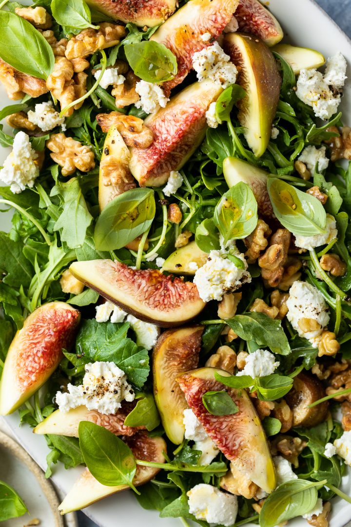 Close up of the fig salad to show goats cheese, walnuts and basil.
