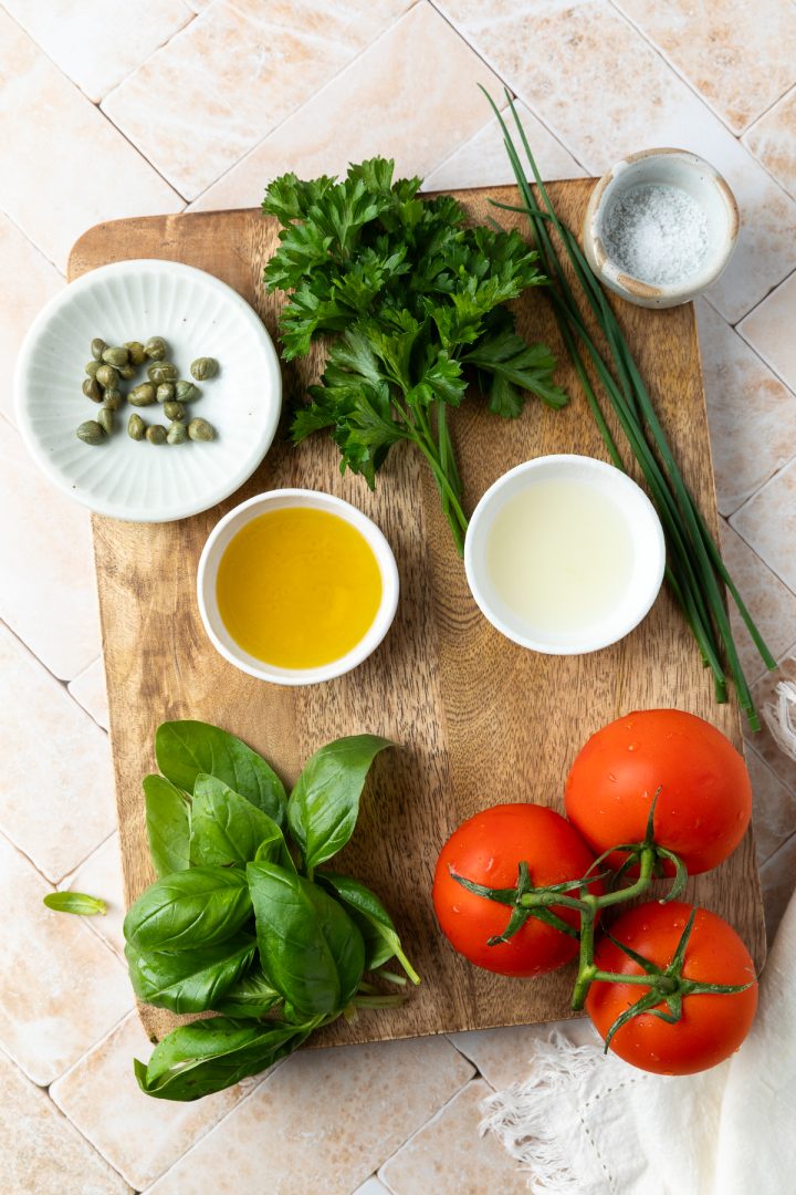Ingredients needed to make the recipe weighed out and placed on a wooden board.