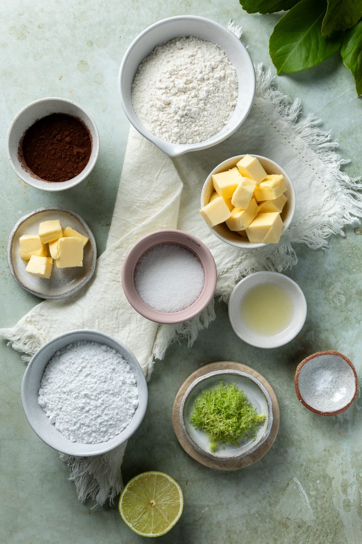 Ingredients needed to make the cookie recipe weighed out and placed in individual bowls.