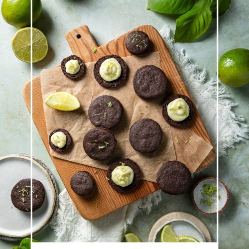 A number of chocolate lime cookies on a wooden board, some showing the piped lime buttercream, others sandwiched together.