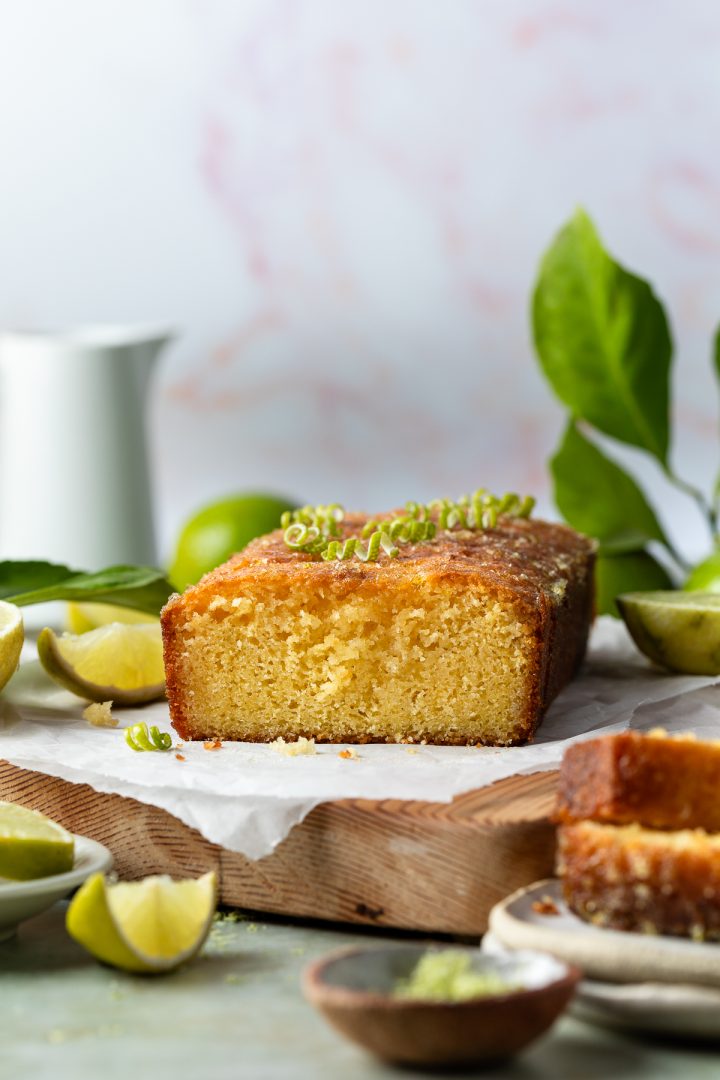 Side view of the cut lime drizzle cake to show the texture of the cake.
