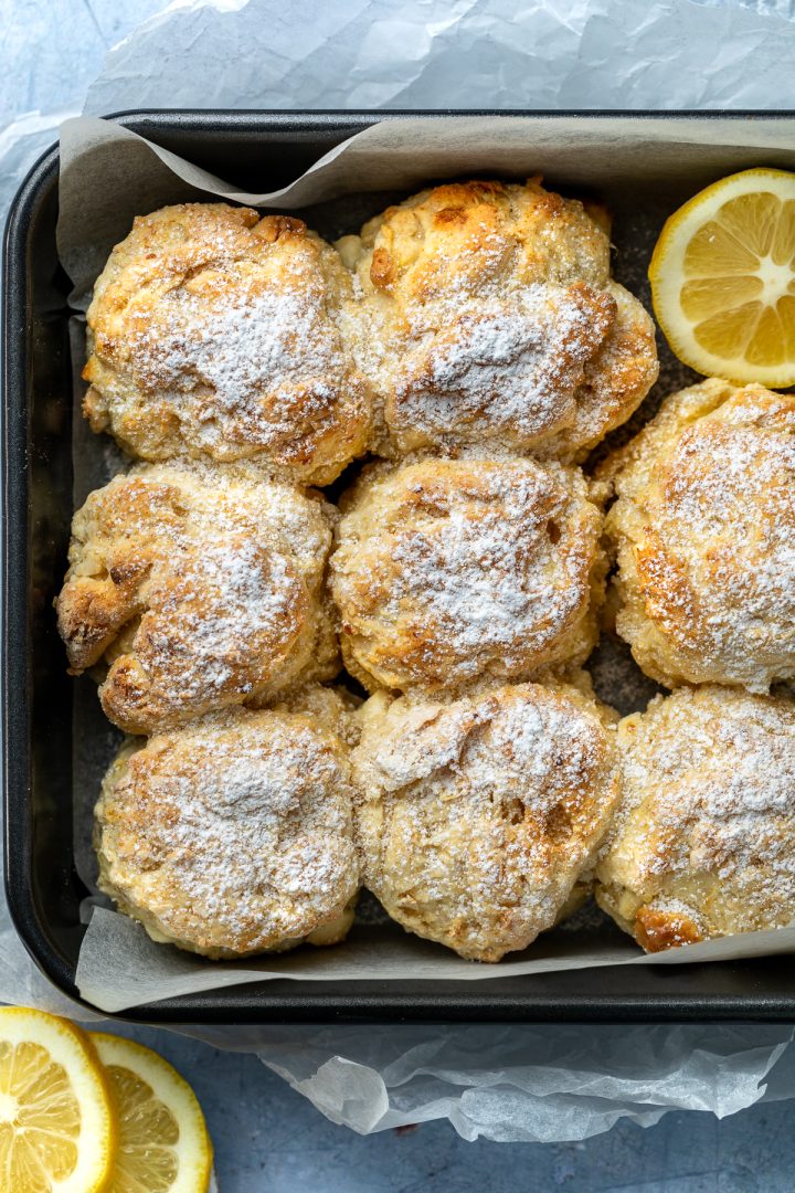 A baking tin of freshly baked lemon white chocolate scones.