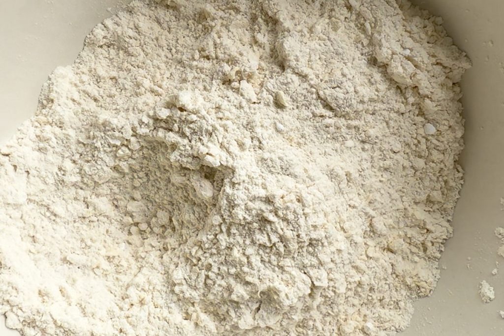 Butter rubbed into the dry ingredients to resemble breadcrumbs.