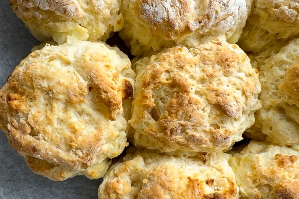The freshly baked scones in the tin.