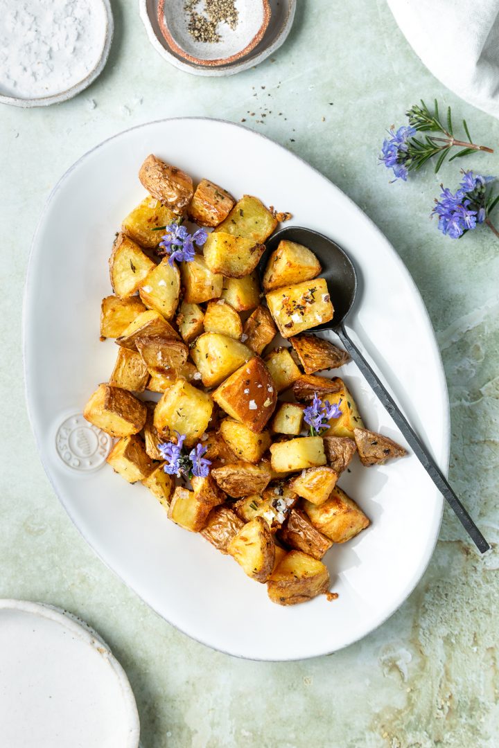 Parmentier potatoes on a serving plate with a spoon.