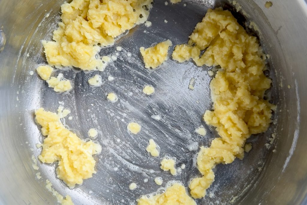The flour and butter mixed together in a smaucepan.