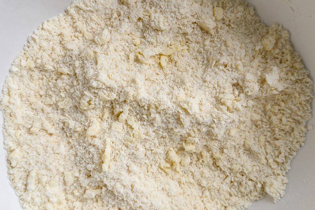 The butter rubbed into the flour to resemble breadcrumbs.