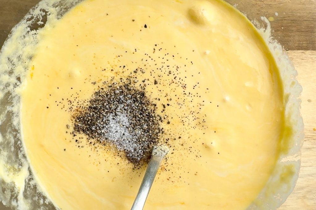 The eggs and creme fraiche mixed together in a bowl.