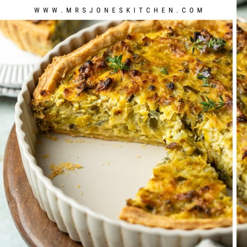 Side view of cut French leek tart in a dish, with text overlay to create a pin for Pinterest.