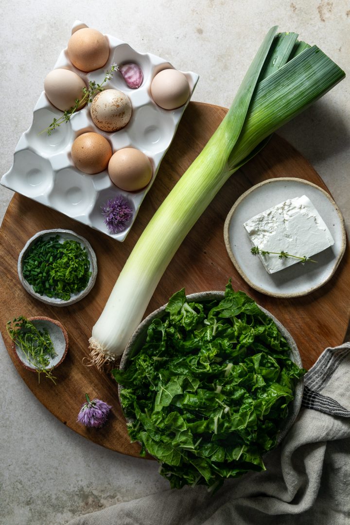 Ingredients needed to make the recipe on a wooden board.