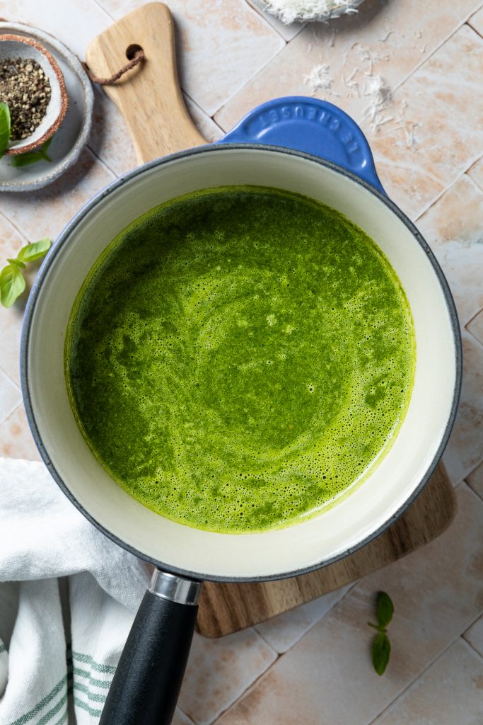 The blended soup in a saucepan.