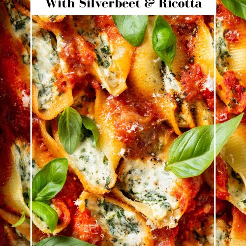 Close up of spinach ricotta stuffed shells with text overlay to create a pin for Pinterest.