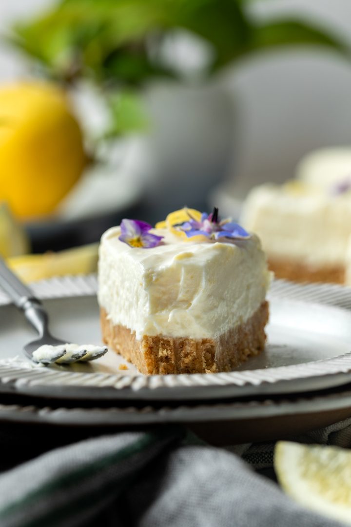 A slice of cheesecake with a forkful taken off the end to show the texture.