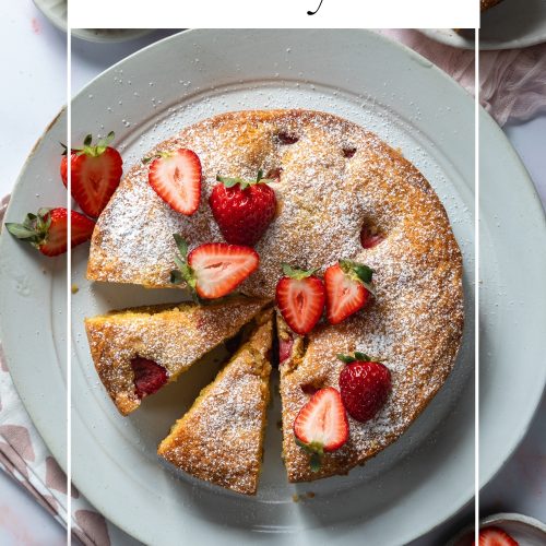 Strawberry cake topped with fresh strawberries, with a text overlay to create a pin for Pinterest.