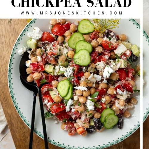 A plate of Mediterranean chickpea salad on a wooden board.