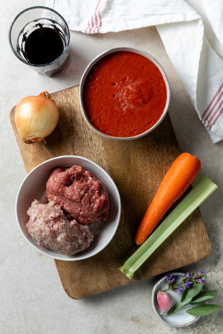 Ingredients needed to make the recipe laid out on a wooden board.