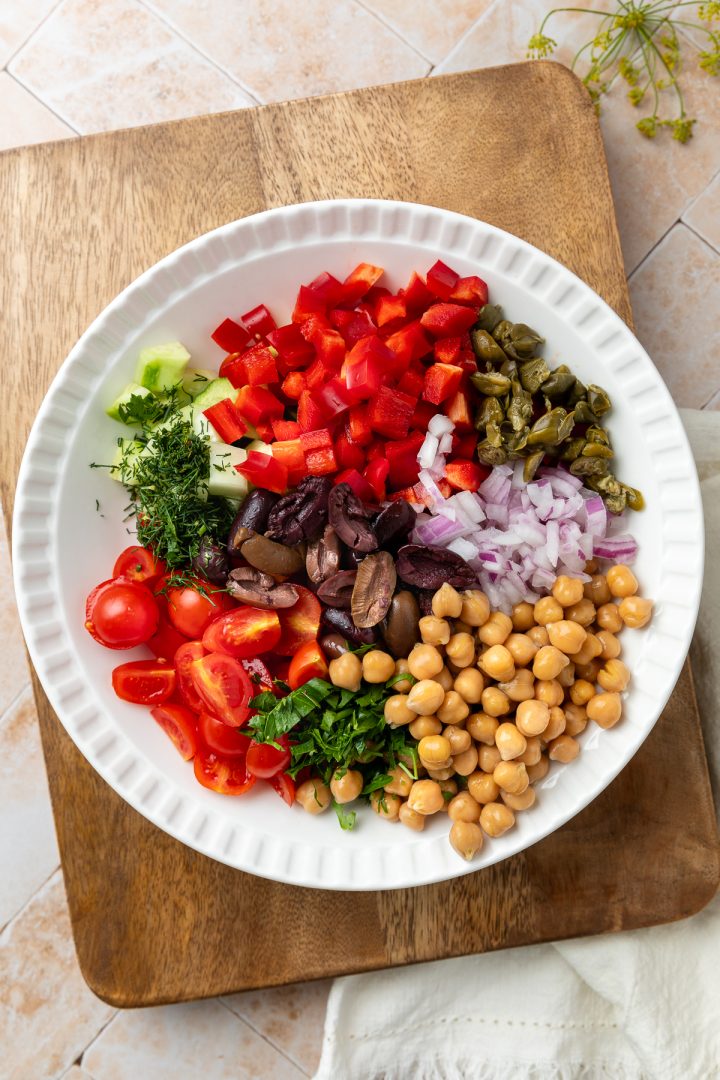 The unmixed ingredients in a bowl, without the feta and dressing.