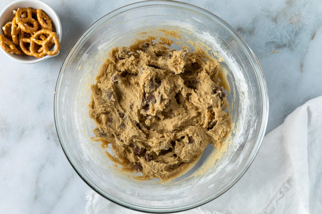The mixed chocolate chip cookie dough in a bowl.