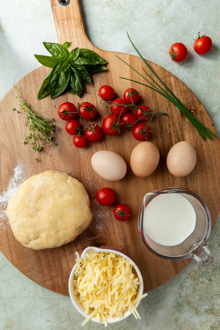 The ingredients needed to make the recipe on a wooden board.