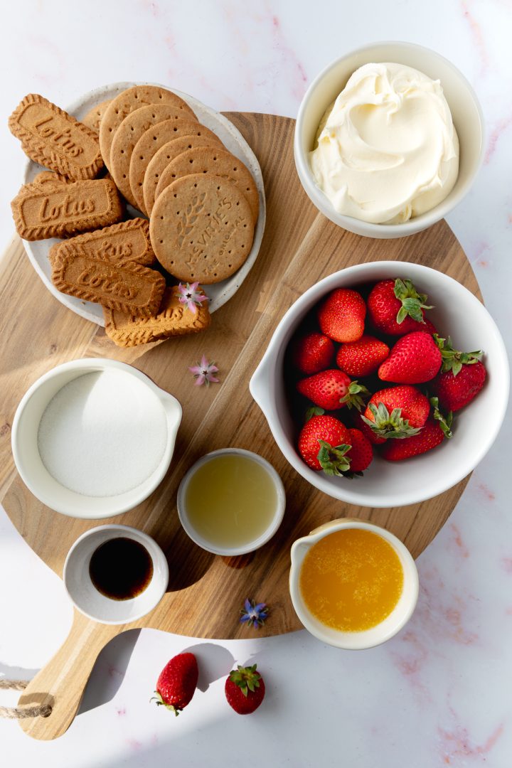 The ingredients needed to make the recipe weighed out and placed on a wooden board.