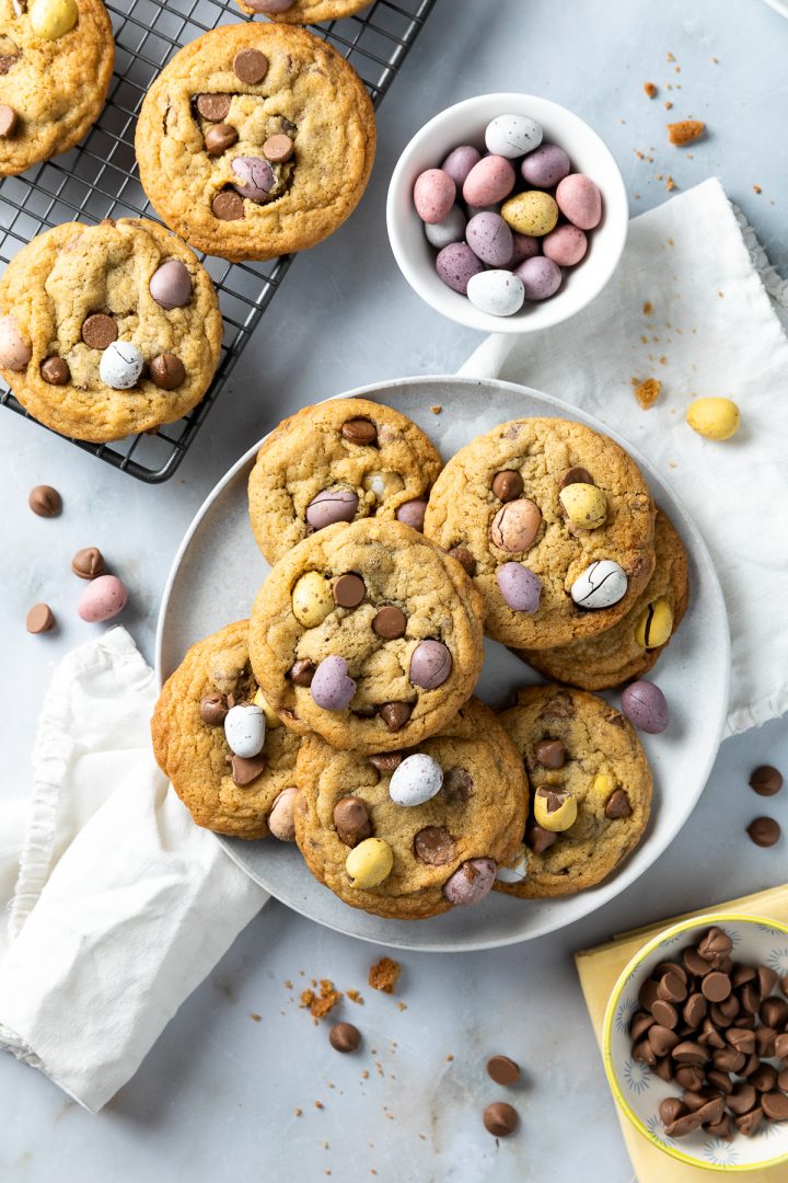 A plate of mini-egg cookies surrounded my mini eggs and chocolate chips.