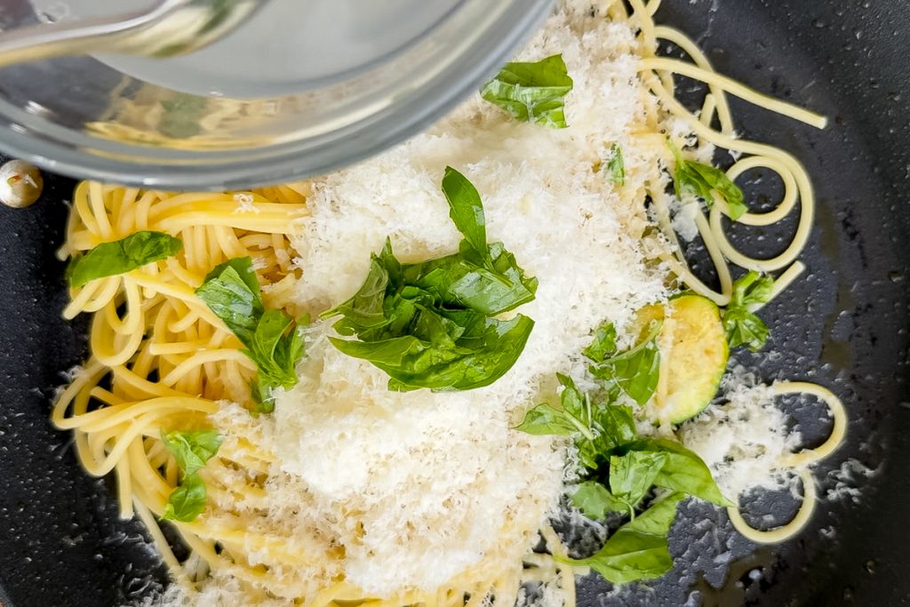 Freshly grated parmesan, fresh basil and the pasta cooking water added to the spaghetti and fried courgettes.