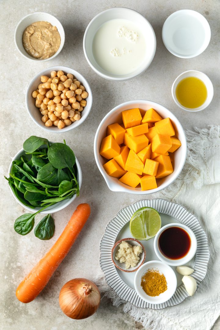 Ingredients needed to make the curry weighed out and placed in individual bowls and dishes.