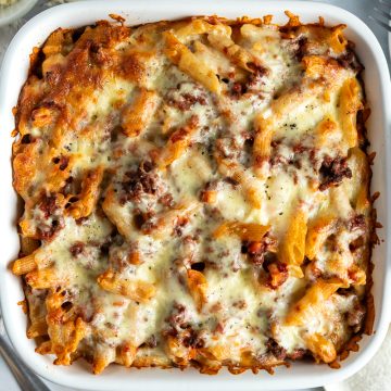 A square dish of baked pasta bolognese.