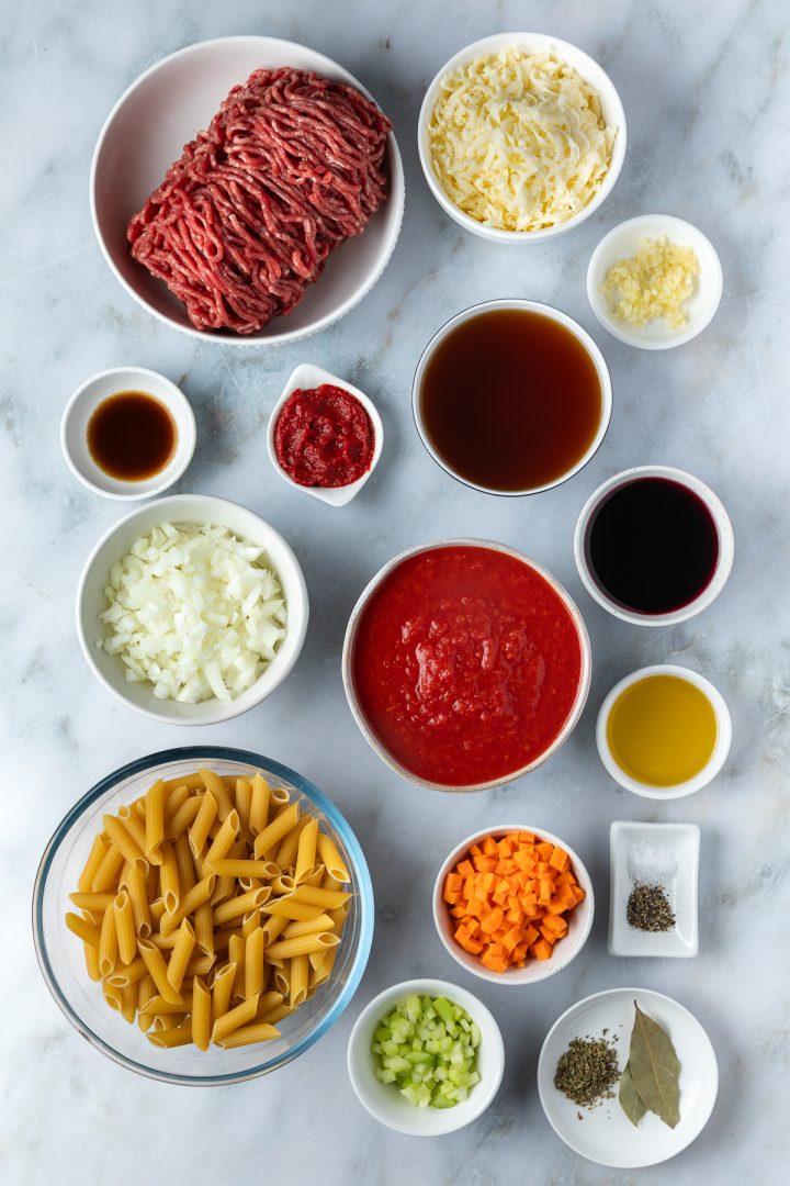 Ingredients needed to make the beef pasta bake measured and placed in individual bowls.