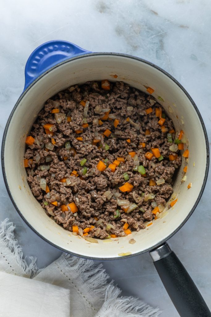 The browned beef minced in a pan.