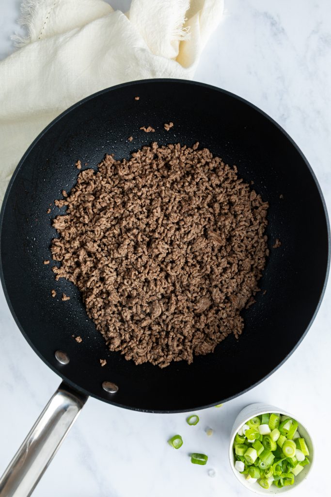 Browned beef mince in a non stick pan.