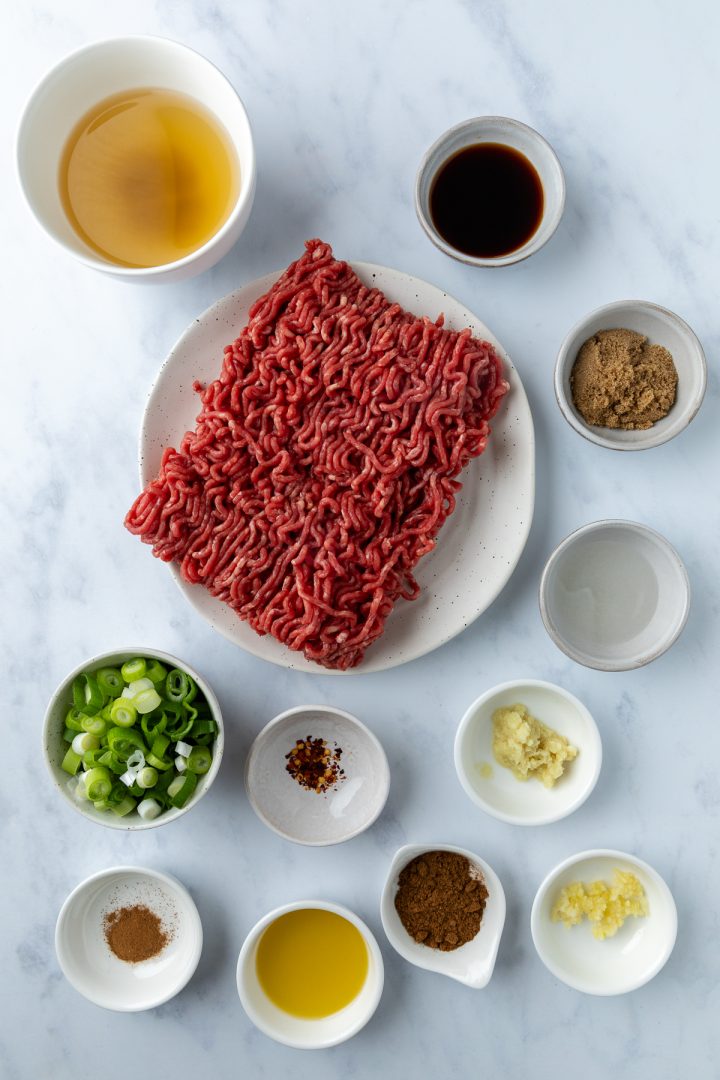 Ingredients needed to make the minced beef recipe weighed out and placed in individual bowls.