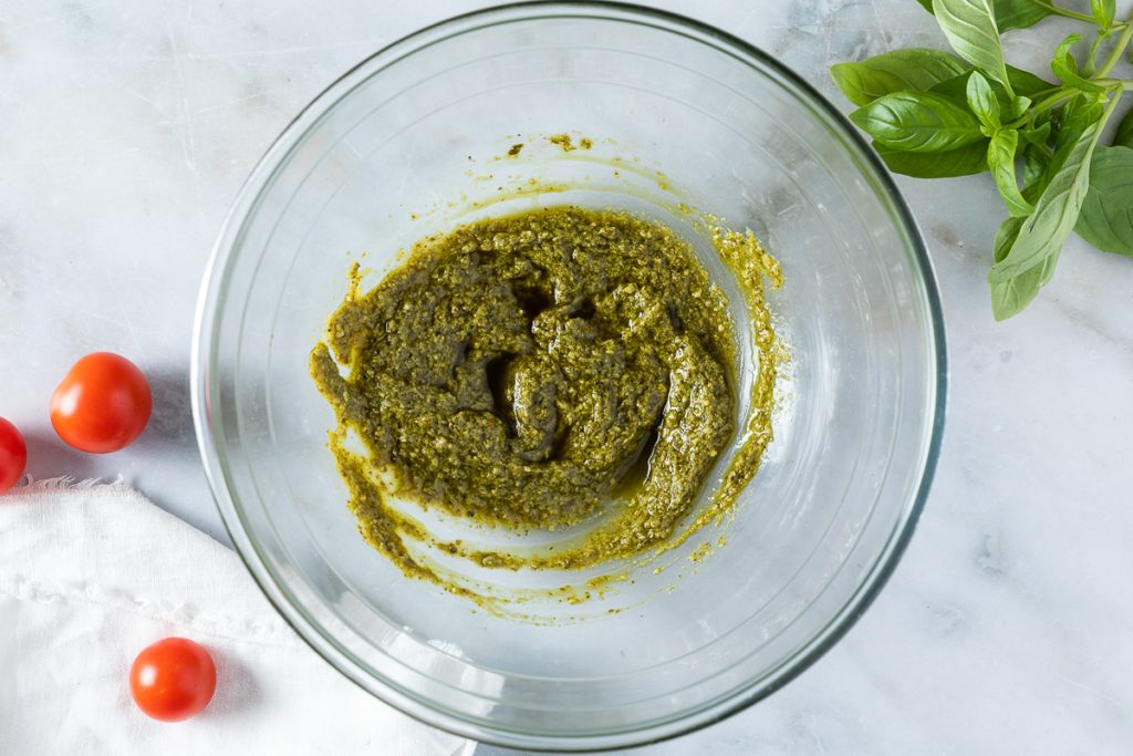 The pesto dressing in a bowl.