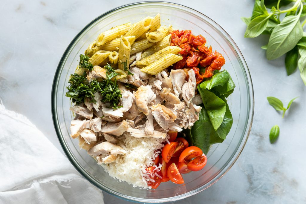 All the salad ingredients in a bowl ready to be mixed.