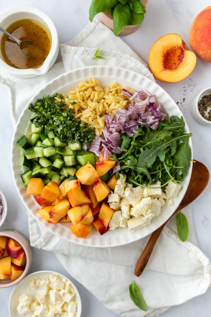 A bowl of the peach salad before being together.