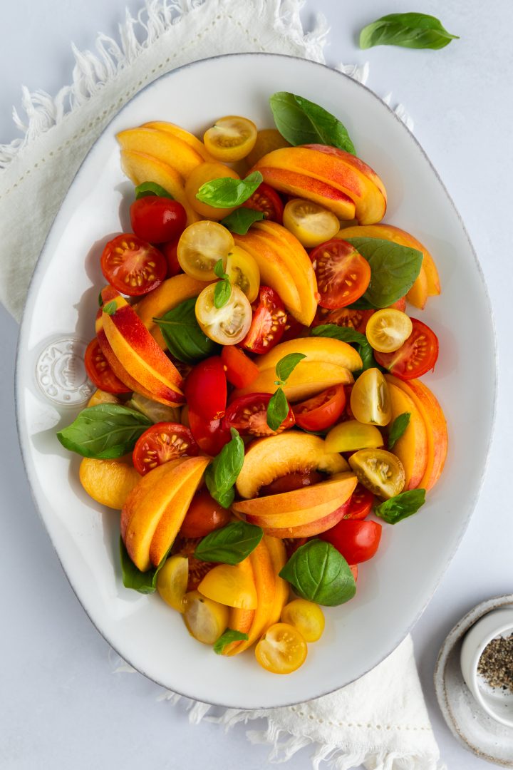 The peach and tomato salad before burrata is added.