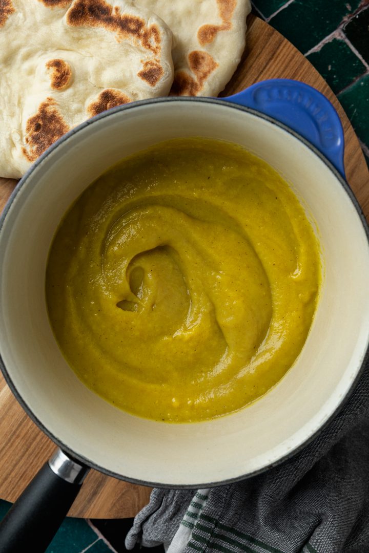 The blended parsnip soup in a pan.