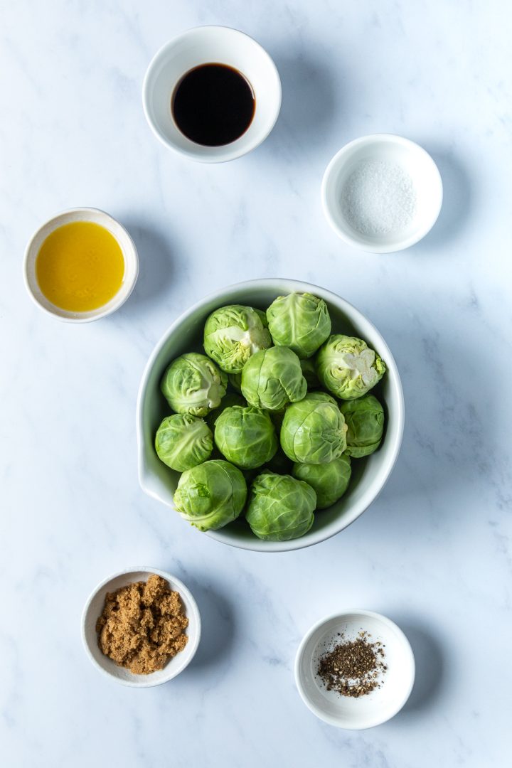 The 6 ingredients needed to make the sprouts recipe weighed out and placed in individual bowls.