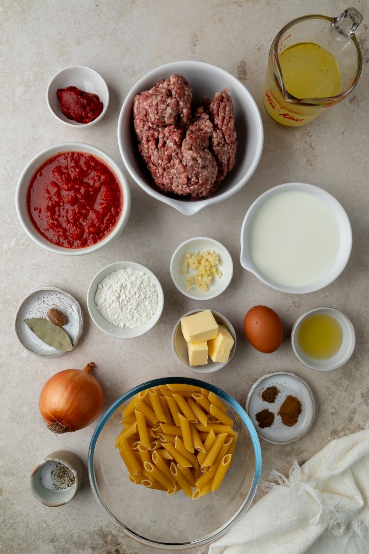 Ingredients needed to make this Greek pasta bake weighed out and placed into individual bowls.