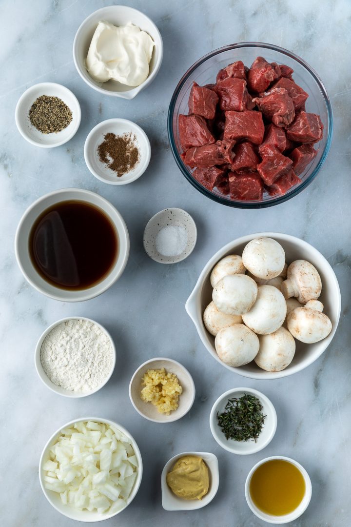 Ingredients needed to make this beef stroganoff recipe weighed out and placed in individual dishes.