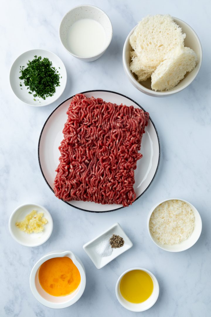 The ingredients needed to make the Italian beef mince meatballs weighed out and placed in individual dishes.