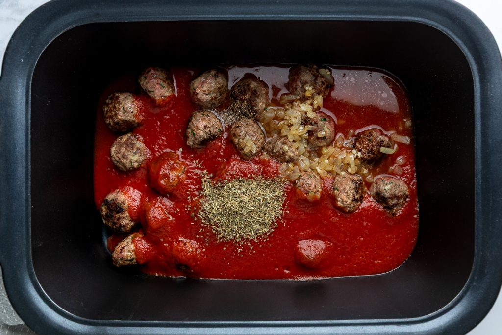 The sauce ingredients added to the slow cooker.